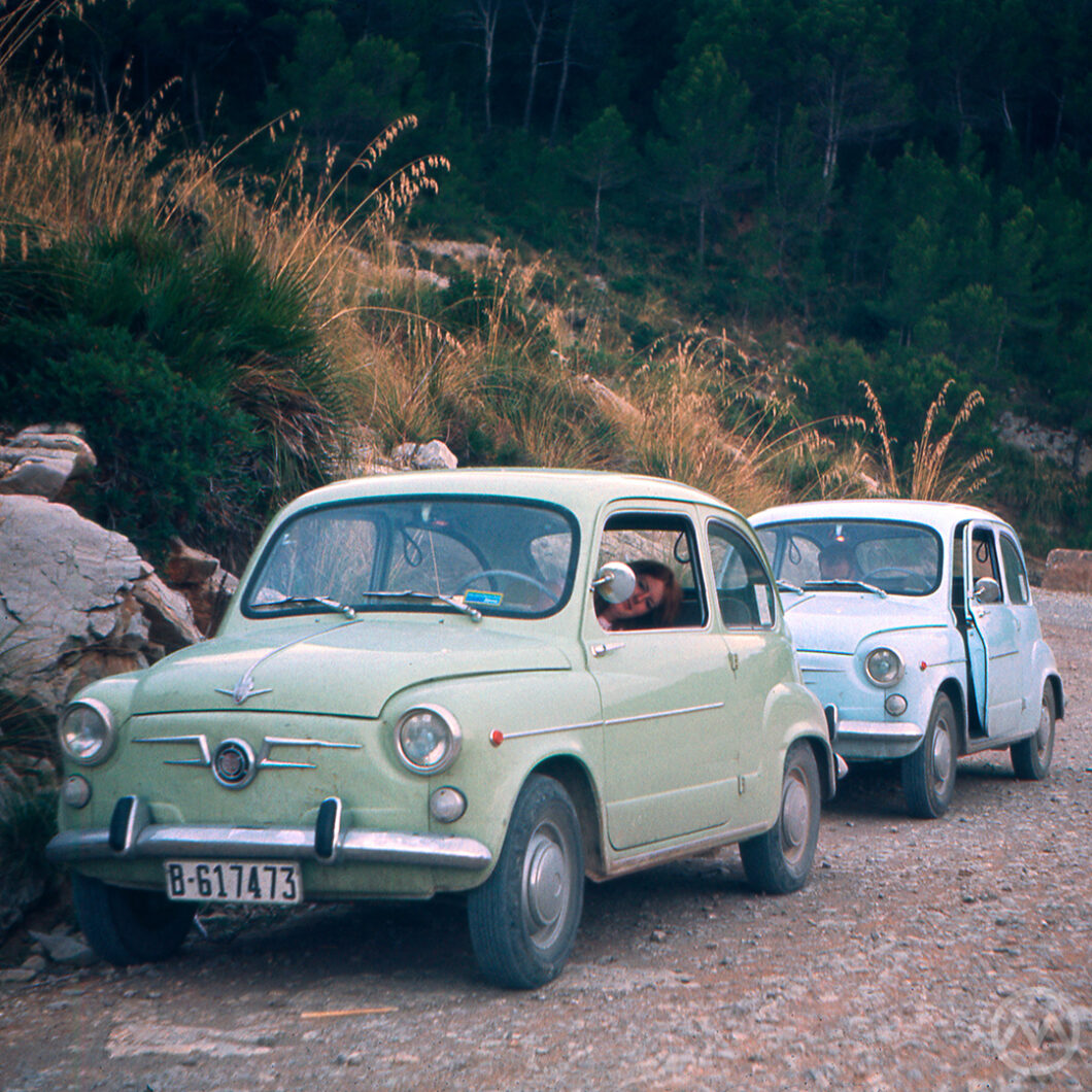 A pair of early SEAT 600 models on a dirt road near Barcelona, Spain, in 1969.